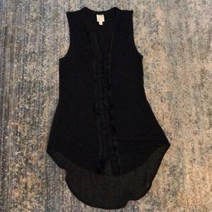 Black sleeveless tunic with sheer lower back